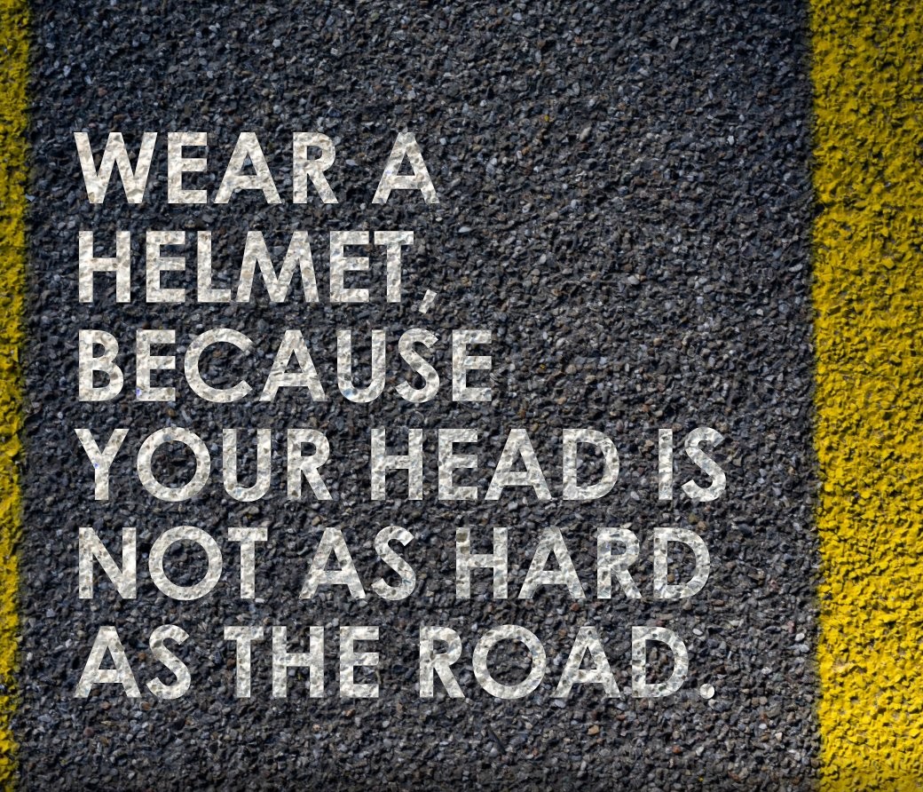 HTP officer fitting a helmet on a child during the Arrive Alive campaign — Khairtabad, Hyderabad, Apr 2026
